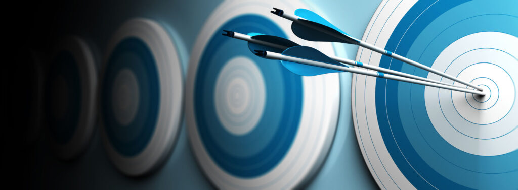 many blue targets and three arrows hitting the center of the first one, horizontal image, banner style
